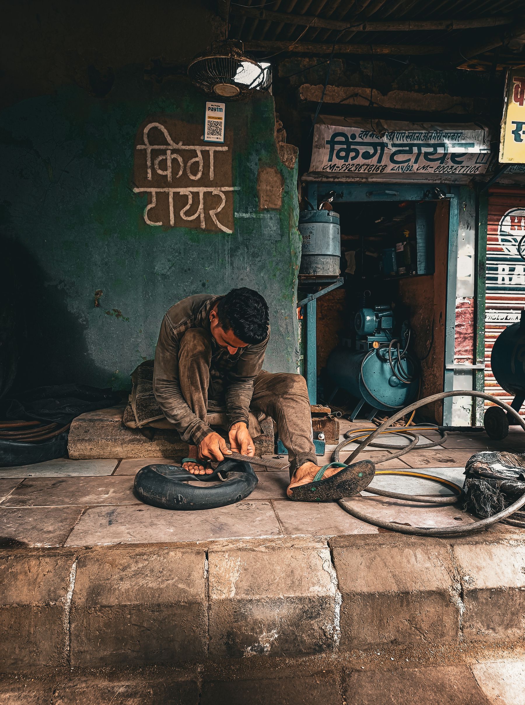 Indian mechanic at a tyre workshop