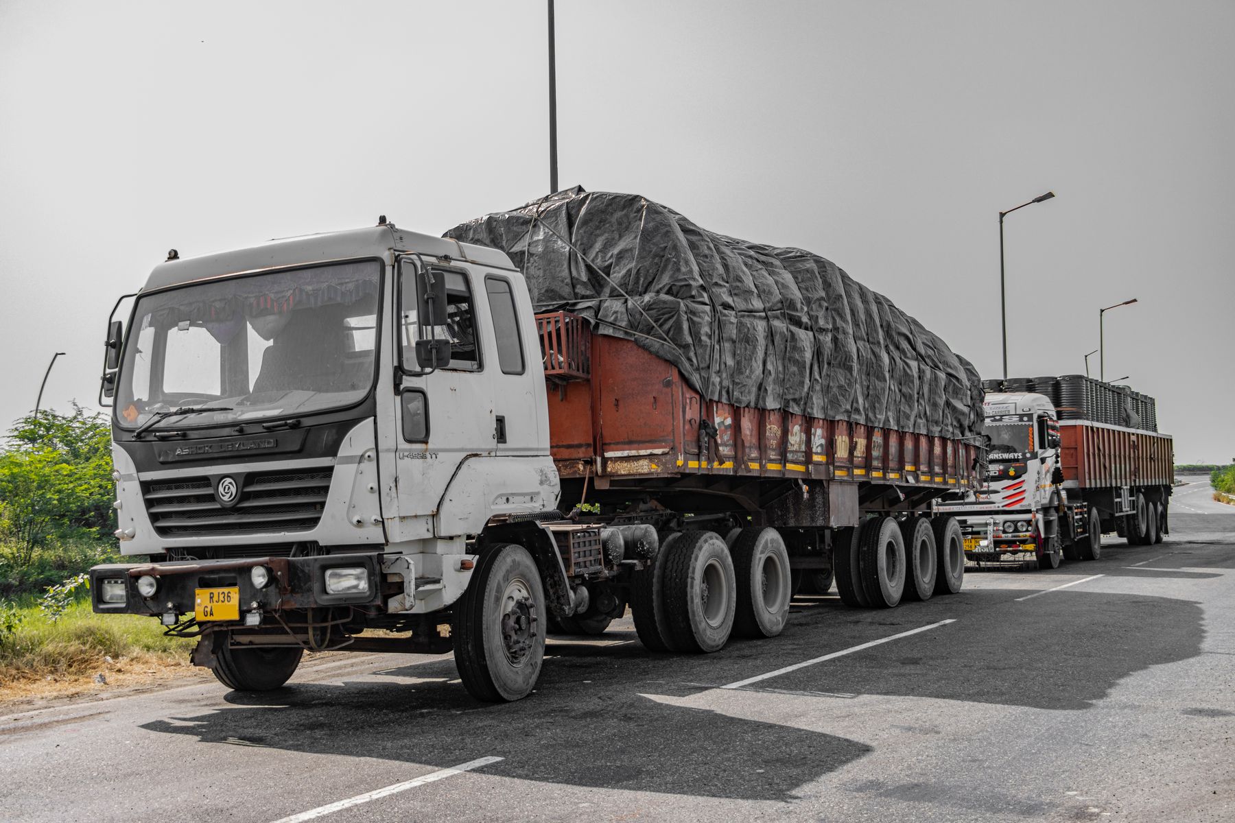 Heavy commercial trucks on an Indian highway