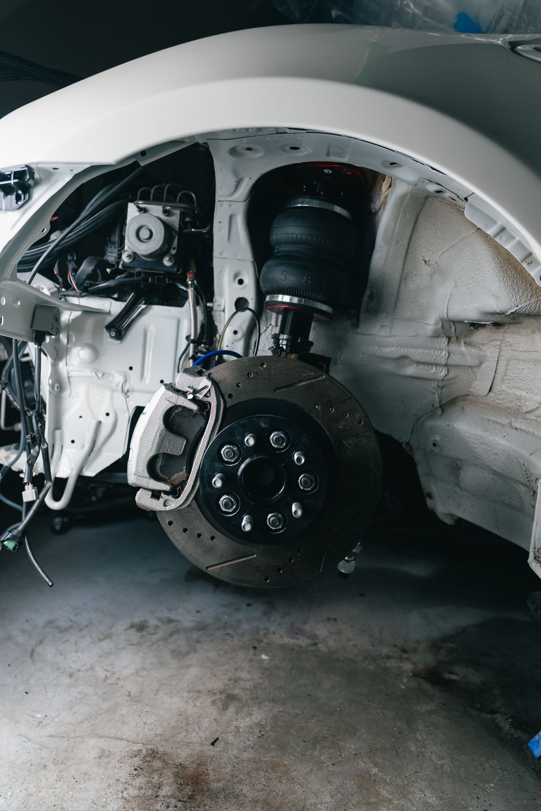 Vehicle suspension and brake assembly